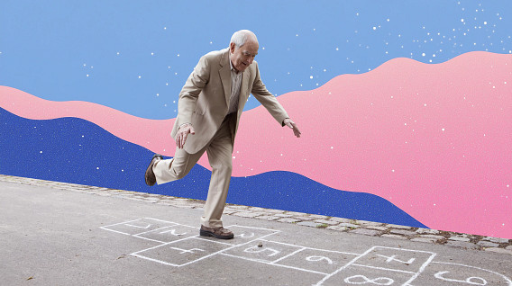 An older person in a beige suit plays hopscotch on a paved surface, balancing on one foot. The background features a colorful abstract design with pink and blue waves and scattered white dots resembling stars.