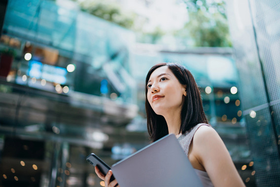 woman outside with laptop