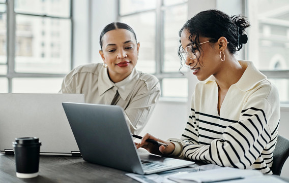 two woman working in office
