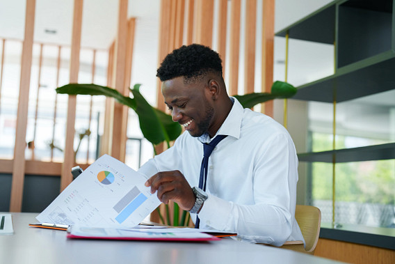 man looking at printed data