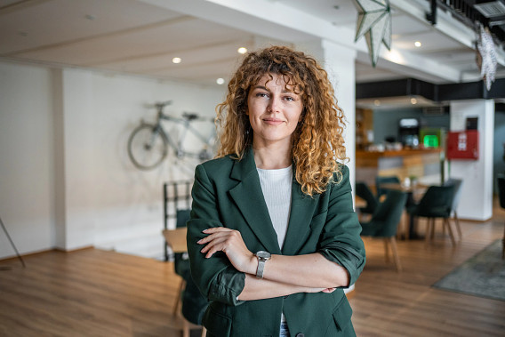 woman looking to camera, arms folded