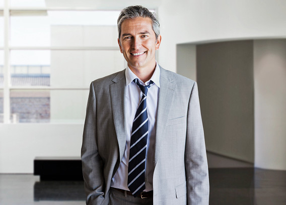 smiling male office worker looking to camera
