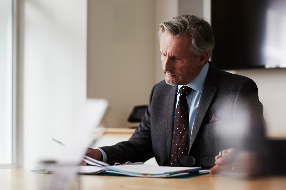 business man signing papers